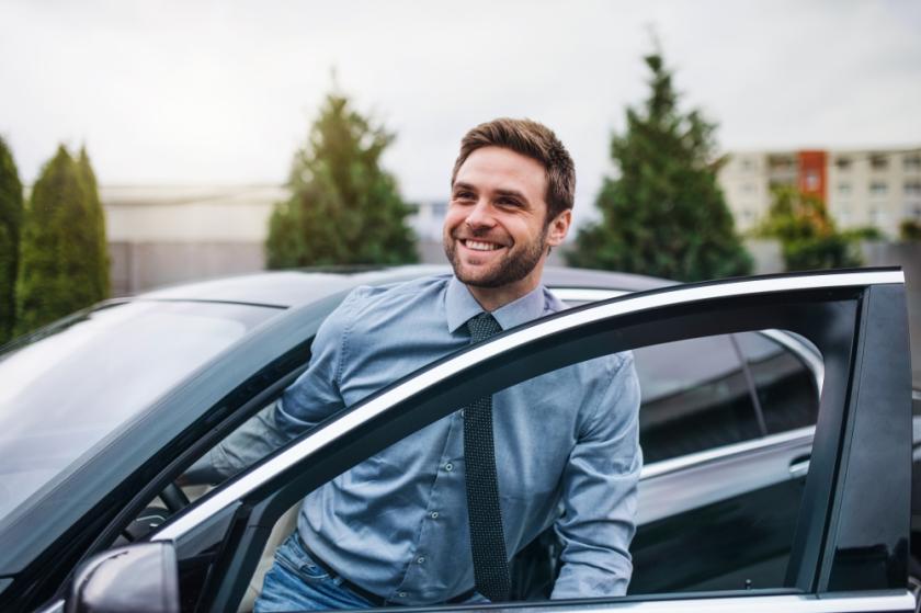 Business Man Getting Out Of Car